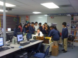 Students huddled around me as we watch something on my computer
